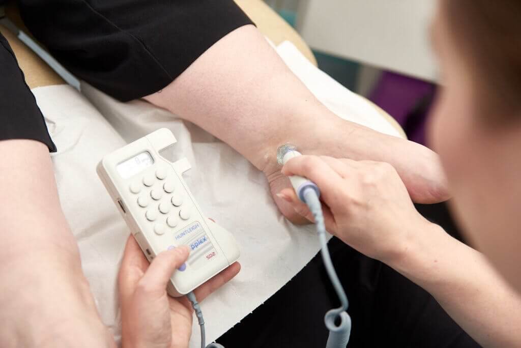 Patient receiving podiatry treatment for chilblains